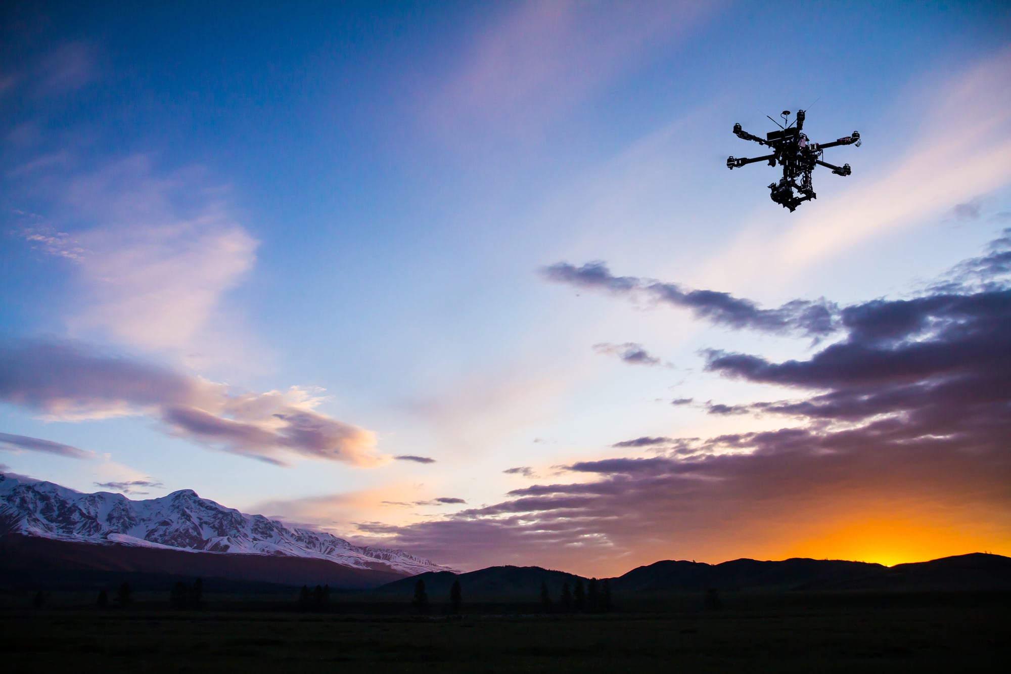 drone flying during sunset